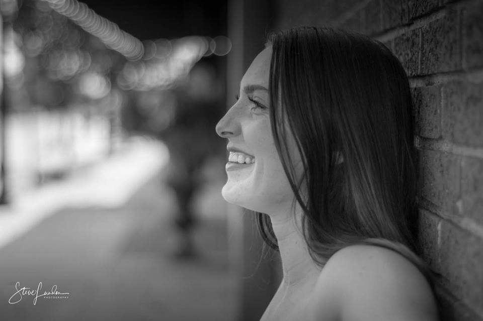Senior portrait against wall - Twin Cities senior photographer Steve Lunden