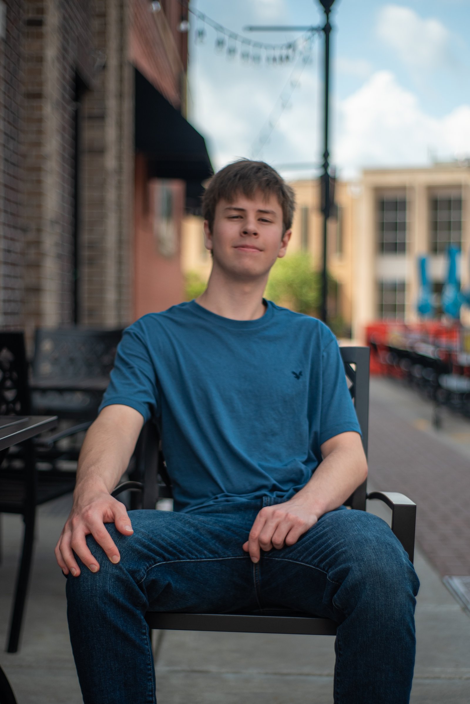 Senior posing in chair - natural light portrait session Twin Cities MN